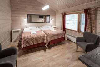 Отель Lapland Hotels Ounasvaara Chalets Рованиеми Стандартное шале (для 4 человек) с сауной-1